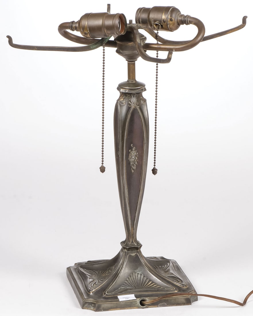 GOOD PAIRPOINT SILVERED METAL LAMP BASE, C 1910: GOOD PAIRPOINT SILVERED METAL LAMP BASE, C 1910. The square base with notched corners and overall decorated in the Art Nouveau style. Marked on the underside of the base and fitted with four-arm shade