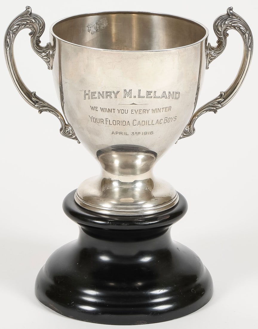 HISTORICAL AMERICAN STERLING LOVING CUP, 1916: HISTORICAL AMERICAN STERLING LOVING CUP, 1916. Comprising a large sterling loving cup with acanthus scroll handles, with dedicatory inscription "HENRY M. LELAND WE WANT YOU EVERY WINTER YOUR FLORIDA C
