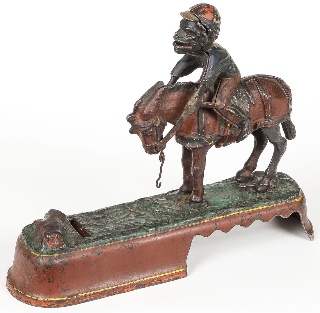 J.& E. STEVENS CAST IRON MECHANICAL BANK: J.& E. STEVENS CAST IRON MECHANICAL BANK. Comprising a vintage and original "I Always Did S'pise a Mule" cast iron mechanical bank, American, fourth quarter of the 19th century. Manufactured by J. & E