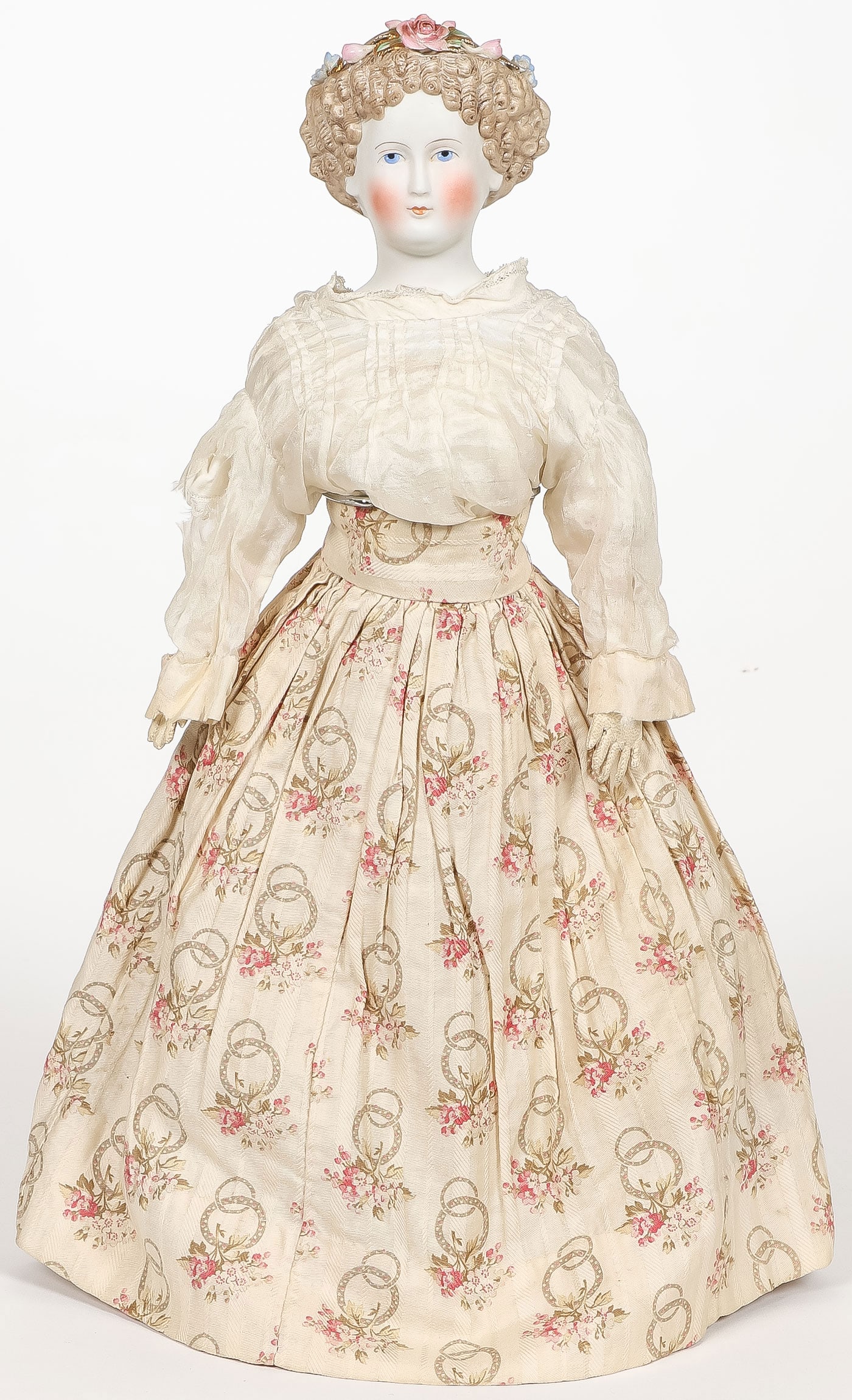 GERMAN CURLY HAIR PARIAN DOLL WITH FLOWERS: GERMAN CURLY HAIR PARIAN DOLL WITH FLOWERS. Comprising a charming German Parian doll with flower decorated curly hair, probably Dornheim / Koch & Fischer, cloth body, leather hands. Height 15.5 inches