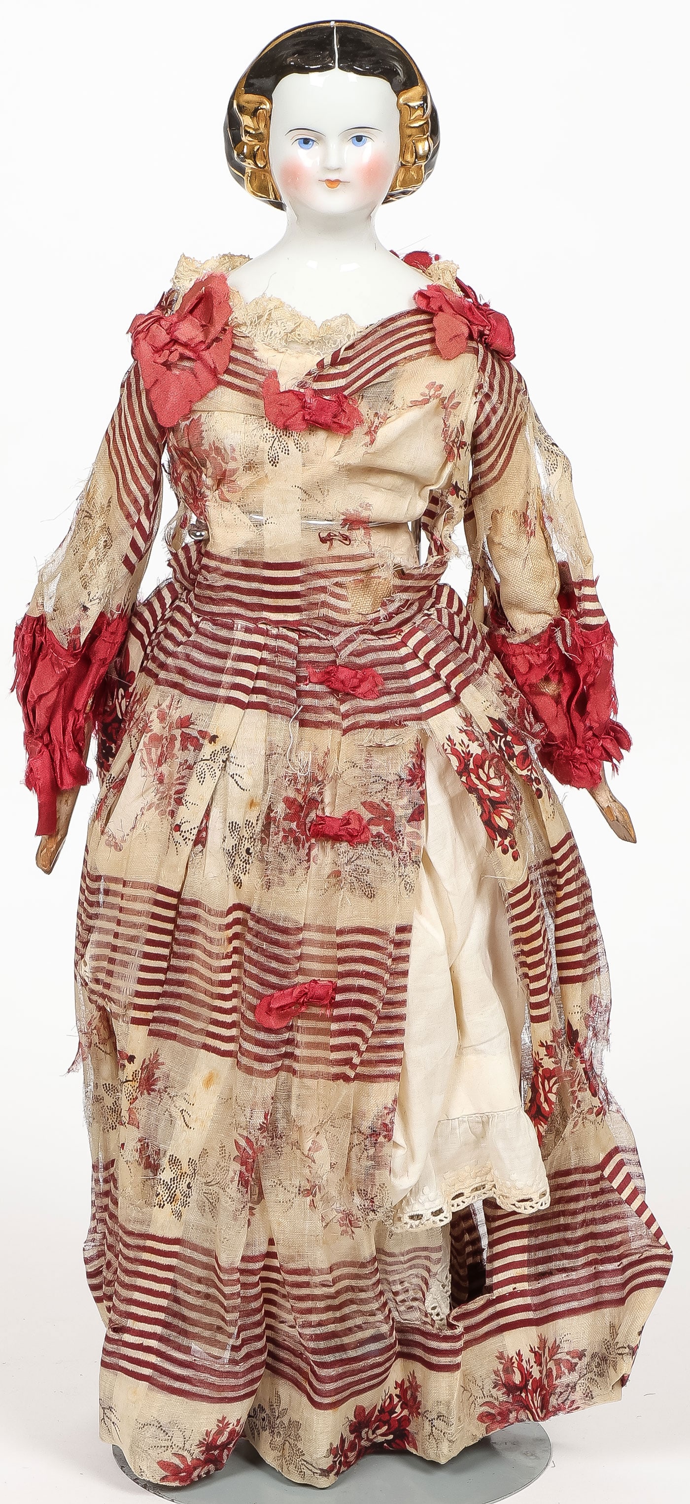 GOOD CHINA HEAD DOLL WITH GOLD SNOOD: GOOD CHINA HEAD DOLL WITH GOLD SNOOD. All original, including silk dress albeit tattered. Height 14.5 inches (36.83cm).SHIPPING NOTICE:If you are not using the Live Auctioneers Live Ship program, Ja