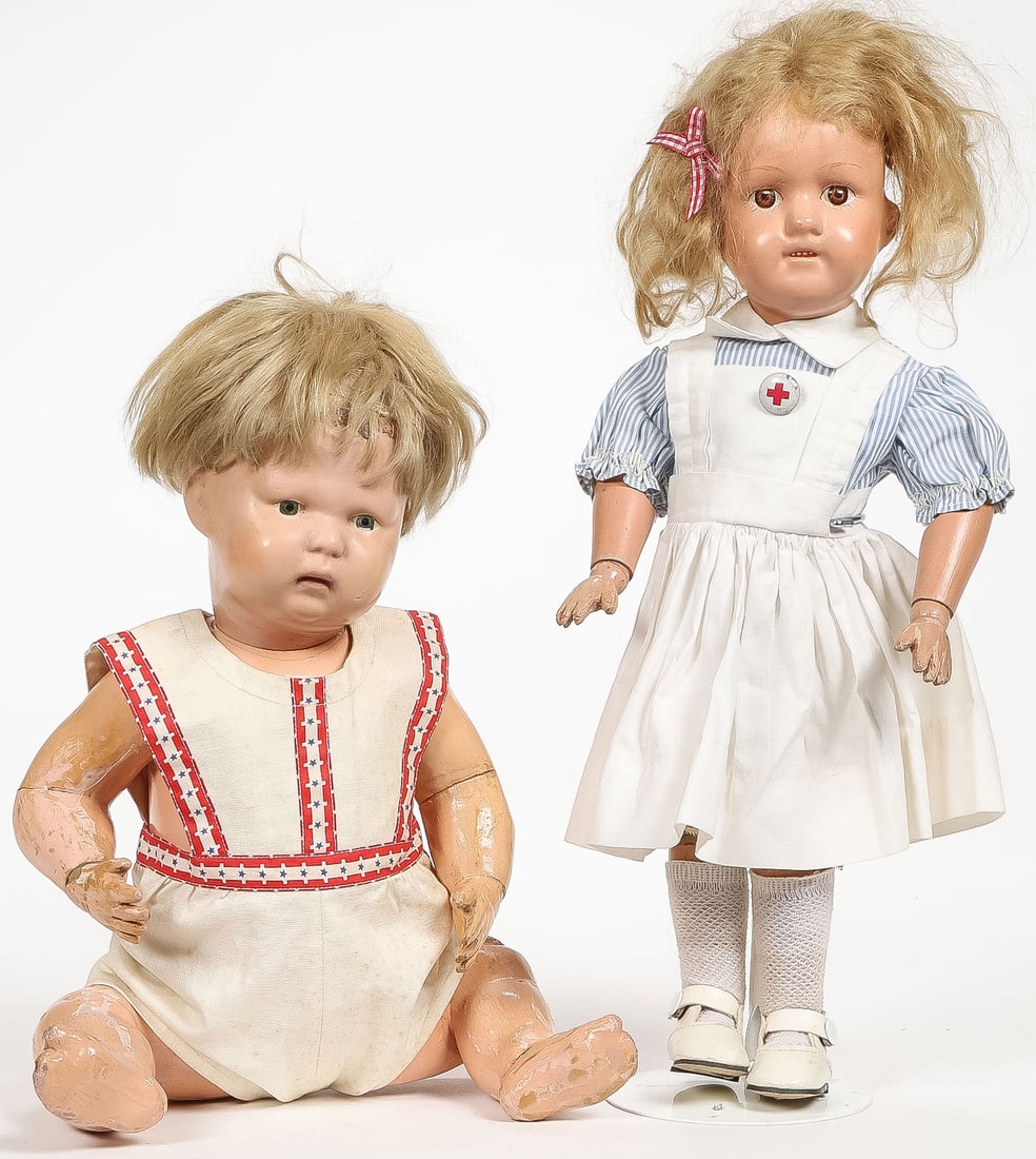 PAIR OF VINTAGE SCHOENHUT DOLLS: PAIR OF VINTAGE SCHOENHUT DOLLS. Comprising a Schoenhut Nature Baby and a Dolly Face, dressed as a nurse. Greatest height 14.5 inches (36.83cm).SHIPPING NOTICE:If you are not using the Live Auctione