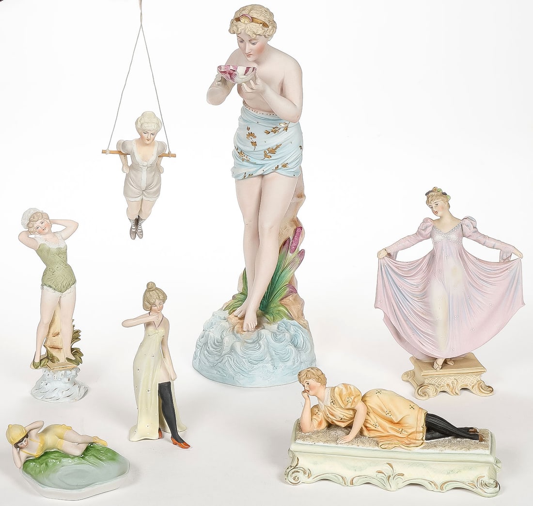 VINTAGE GERMAN BISQUE BEAUTIES, C. 1890: VINTAGE GERMAN BISQUE BEAUTIES, C. 1890. Comprising seven individual hand-colored bisque figures depicting various beauties, including a large figure of Venus holding a clamshell; a standing bathing