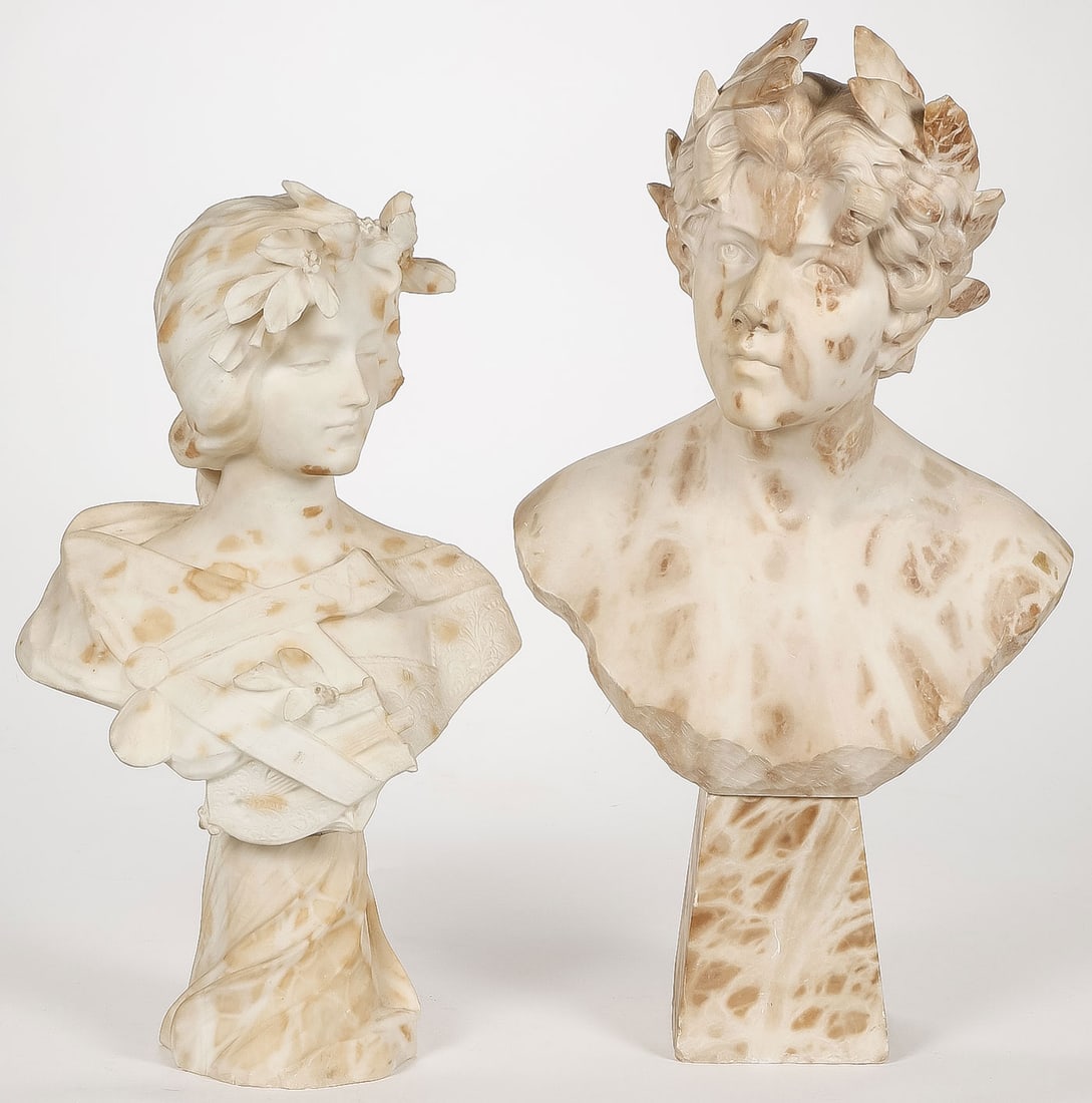 PAIR OF CARVED CLASSICAL BUSTS, C. 1890: PAIR OF CARVED CLASSICAL BUSTS, C. 1890. Comprising a pair of carved alabaster busts, including a bust of Sapho, height 22.25 inches (56.5cm). Together with another bust wearing a laurel wreath, heigh