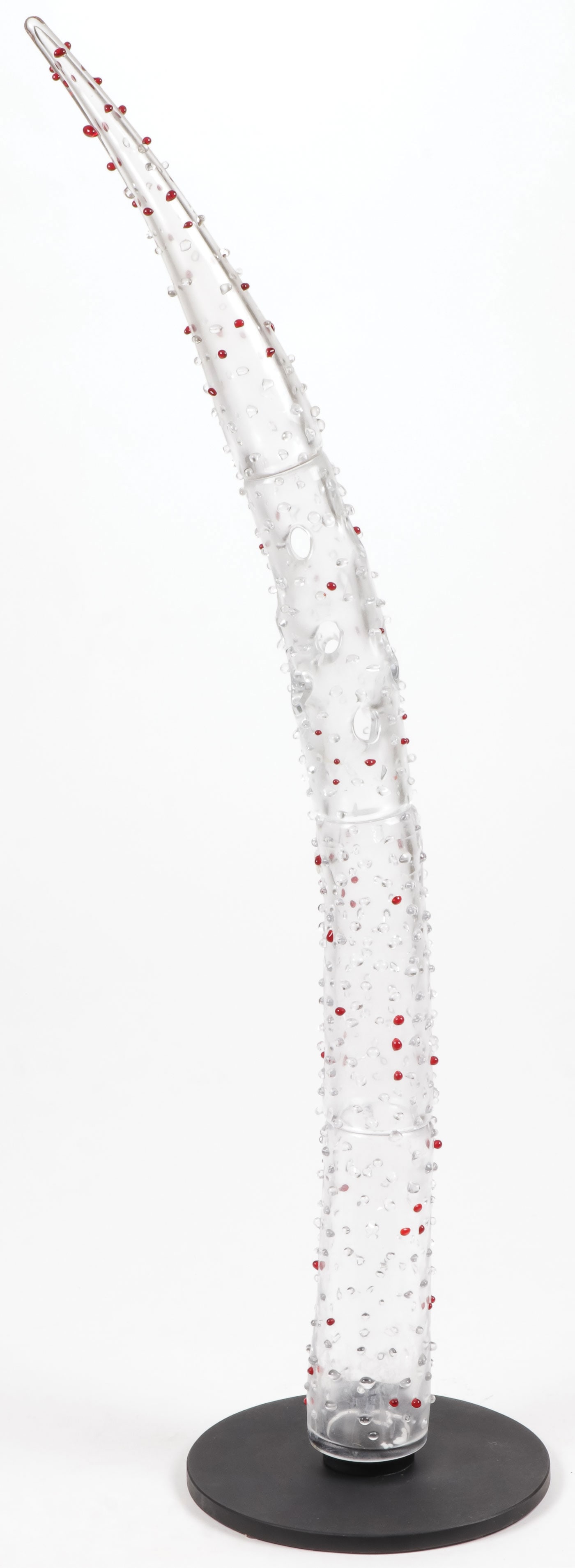 INGO MAURER VENETIAN GLASS TUSK: INGO MAURER VENETIAN GLASS TUSK. Comprising a large and impressive clear glass and hobnail decorated tusk by Ingo Maurer (1932-2019) for Salviati, 20th century, with Salviati label, on black plexigla
