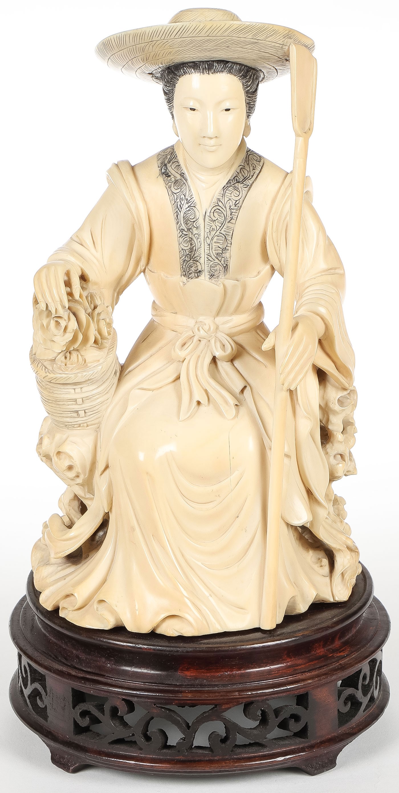 FINE CHINESE CARVED FIGURE, QING: FINE CHINESE CARVED FIGURE, QING. Depicting a large and impressive carved figure of Xiang Fei shown seated holding a basket of flowers and wearing a wide brimmed hat. Of good proportions and anatomy,