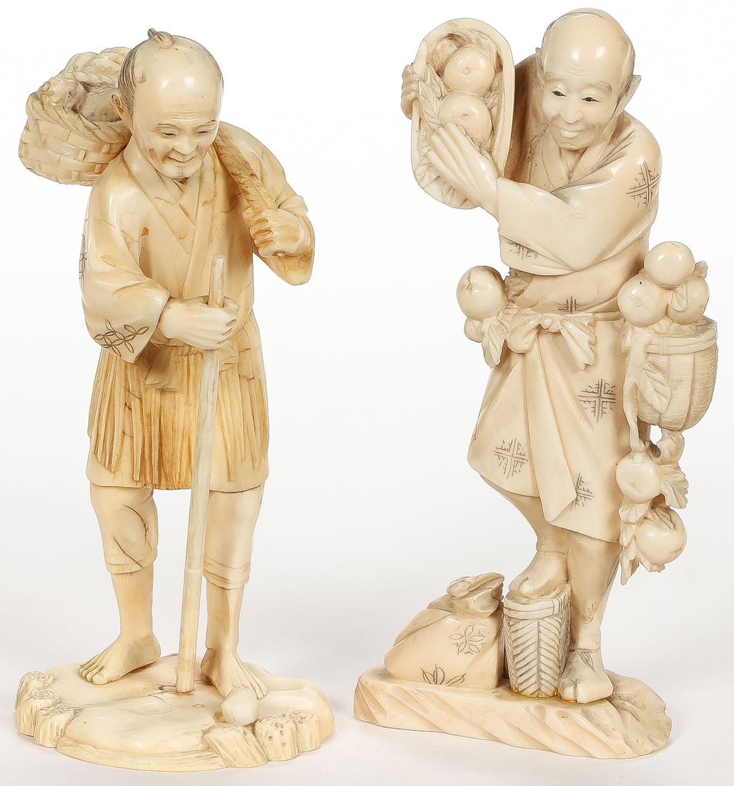 PAIR OF JAPANESE CARVED OKIMONO, MEIJI: PAIR OF JAPANESE CARVED OKIMONO, MEIJI. Comprising two finely carved okimono carved in full round, of good proportions and anatomy, resting on integral bases and each depicting a merchant. The undersi