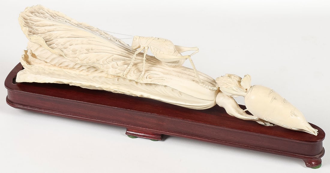 CHINESE CARVED GRASSHOPPER ON CABBAGE: EXCEPTIONAL CHINESE CARVED GRASSHOPPER ON CABBAGE. Realistically and finely carved in full round with excellent detailing throughout, resting on a conforming wood stand. The carving 10 inches (25.5cm