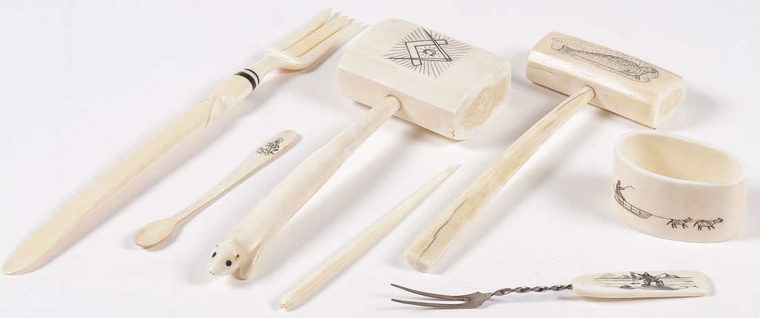 GROUP OF ESKIMO CARVED UTENSILS: GROUP OF ESKIMO CARVED UTENSILS. Comprising a group of seven carved and scrimshawed walrus tusk utensils, including two mallets, two forks, a spoon, a napkin ring, and hairpin or awl. Greatest measure