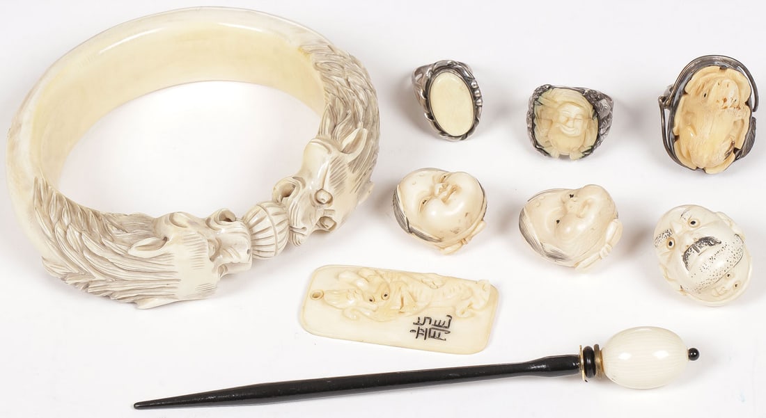 ASIAN CARVED GROUP: ASIAN CARVED GROUP. Comprising a group of nine individual pieces, including a large carved bangle with opposing dragon heads, three double-faced netsukes, a hairpin, a rectangular pendant with a drago