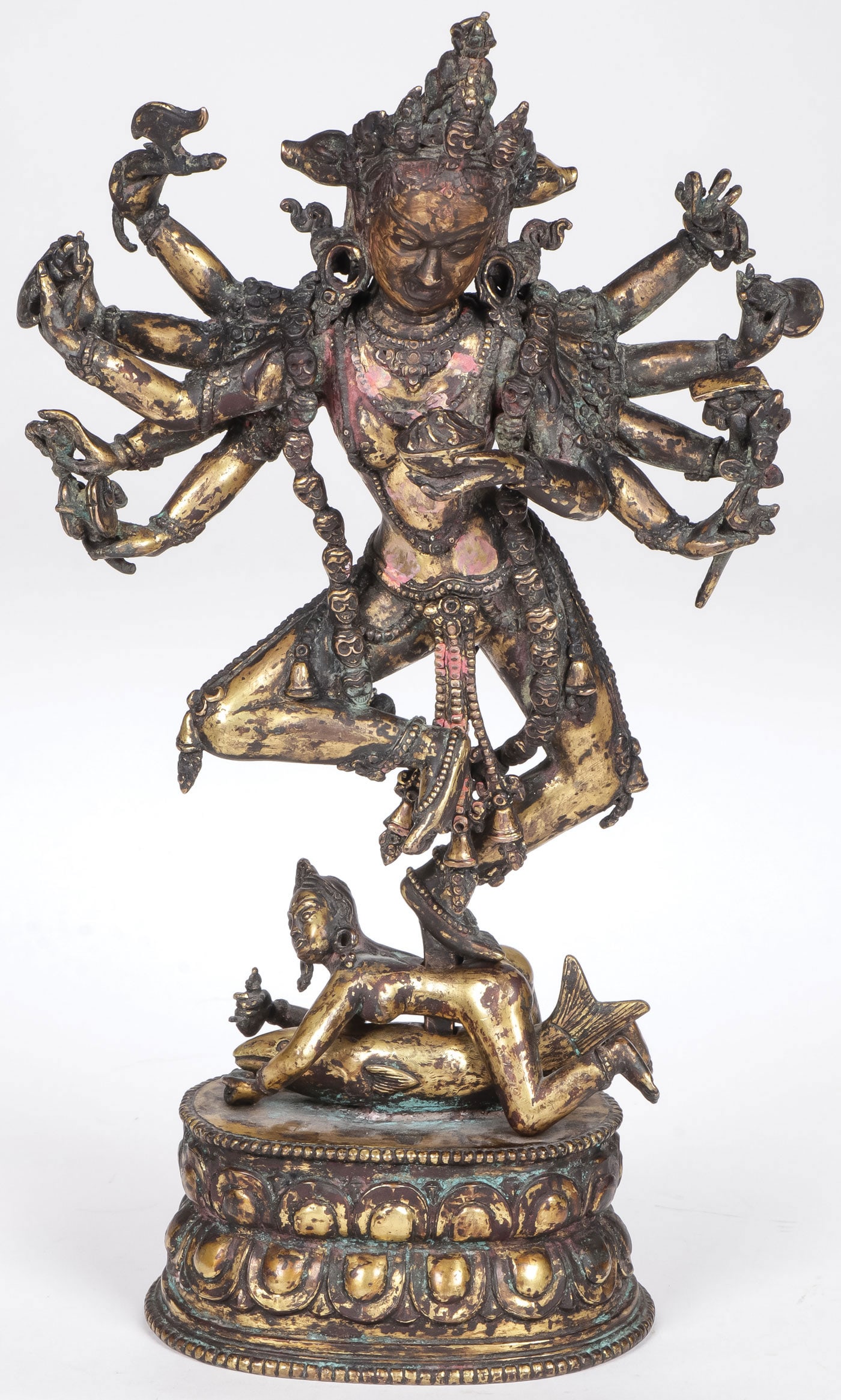A GOOD SINO-TIBETAN GILT BRONZE SHIVA: A GOOD SINO-TIBETAN GILT BRONZE SHIVA. Comprising a finely cast gilt bronze figure of Nataraja, likely 18th century. Shiva is shown here wearing a skull necklace, holding a variety of Buddhistic attri