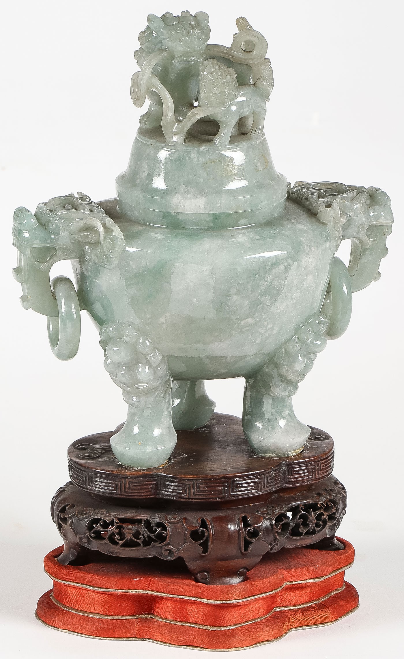 GOOD CHINESE CARVED JADE CENSER, QING: GOOD CHINESE CARVED JADE CENSER, QING. Comprising a finely carved three-legged jade censer, with foo-head ring handles and a fitted cover with finely carved foo-lion and cub, resting on a vintage conf