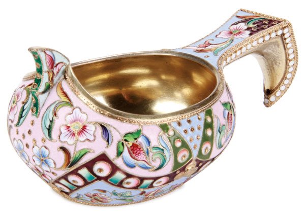 RUSSIAN SILVER ENAMEL KOVSH, SEMENOVA, 1908-1917: A RUSSIAN SILVER-GILT AND SHADED ENAMEL KOVSH, MARIA SEMENOVA, MOSCOW, CIRCA 1908-1917. Of traditional form, with hook handle and raised prow, the sides and handle enameled in geometric motifs and fol