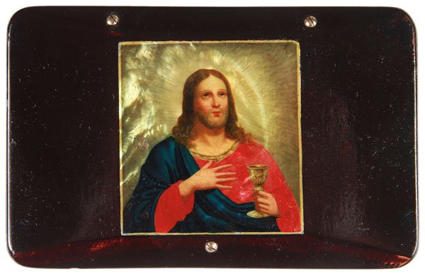AN INTERESTING RUSSIAN LACQUER BOX, CIRCA 1850: AN INTERESTING RUSSIAN LACQUER BOX, CIRCA 1850. Of rectangular form with chamferd hinged lid and rounded corners, the cover set with a painting of Christ on a mother of pearl inlaid ground, and with t