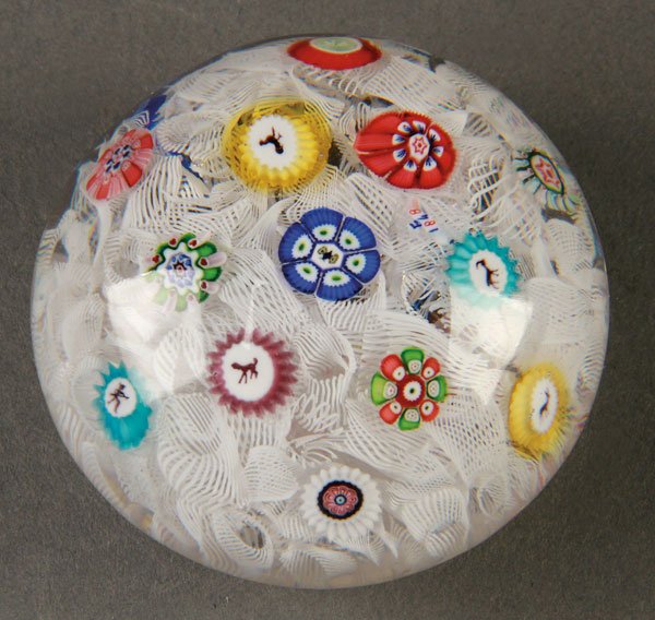 A BACCARAT 1848 PAPERWEIGHT: A BACCARAT 1848 PAPERWEIGHT. With animal forms in multi-colored rosette canes on a Latticino scramble base, signed with “Bover 1848”. Diameter 2.25 inches (5.5 cm).