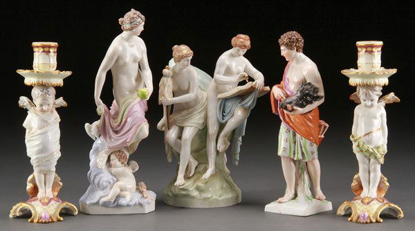 FIVE PIECE GROUP KPM FIGURAL PORCELAIN, 19TH C: A FIVE PIECE GROUP OF KPM FIGURAL PORCELAIN, 19TH CENTURY. Comprising two standing winged cherub form candle holders, a nude figure with cupid sleeping, a Neo-classic man with boars head trophy, and a