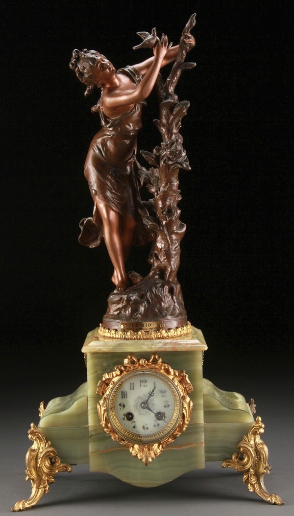 Victorian "Le Nid" Parlor Clock, After Moreau: A VICTORIAN "LE NID" FIGURAL PARLOR CLOCK, AFTER MOREAU, LATE 19TH CENTURY. The bronzed metal figure of a woman with bird raised on a green onyx case with gilt metal mounts. Height 24.25 inches (61.5 