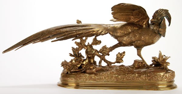 GILT FRENCH BRONZE PHEASANT BY MOIGNIEZ: JULES MOIGNIEZ(French 1835-1894) Pheasant atop Rockery Base with Lizard at It's Feet Bronze with gilt patina Inscribed on base "J. Moigniez" Length 30.25 inches (76.8 cm)