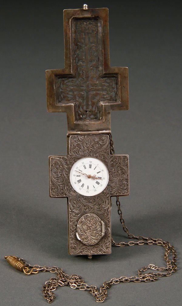 CONTINENTAL SILVER CRUCIFIX CASED PENDANT WATCH: A CONTINENTAL SILVER CRUCIFIX FORM CASED PENDANT WATCH, PROBABLY 19TH CENTURY. The reticulated scrolled foliate cover opening to reveal a finely chased acanthus ground, containing a key wind watch mov