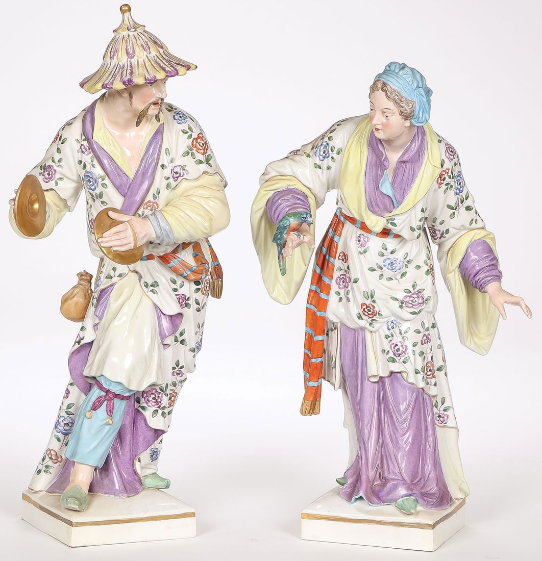 PAIR OF GOOD KPM CHINOISERIE PORCELAIN FIGURES: PAIR OF GOOD KPM CHINOISERIE PORCELAIN FIGURES. Comprising a large and finely decorated pair of KPM hand-painted porcelain Chinoiserie figures depicting a man playing cymbals and a woman holding a par