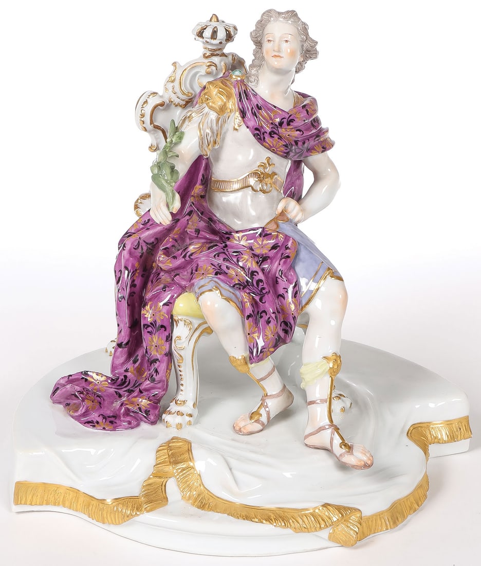 A MEISSEN FIGURE OF AN EMPEROR: A MEISSEN FIGURE OF AN EMPEROR. Possibly Louis V modeled as a Roman emperor seated on a richly scrolled chair surmounted by a crown, wearing lavish robes of purple decorated with gilt and black scroll