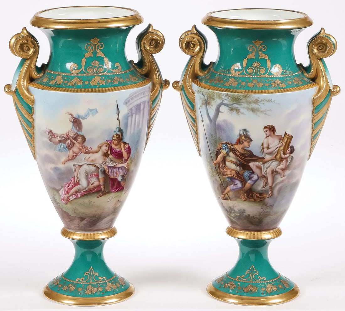 PAIR OF SEVRES HAND PAINTED URNS: PAIR OF SEVRES HAND PAINTED URNS. Comprising an exceptional matching pair of hand painted Sevres urns, resting on socle bases with gilt banding and gilt grapevines on an emerald green ground, with