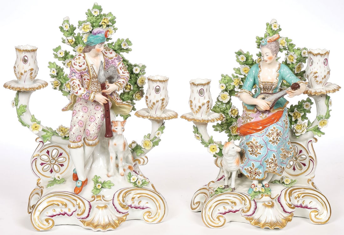 PAIR OF CHELSEA PORCELAIN CANDELABRA: PAIR OF CHELSEA PORCELAIN CANDELABRA. Comprising a matching pair of Chelsea bocage porcelain two-light candelabra. Each on rocaille scroll gilt-decorated bases depicting a shepherd and shepherdess