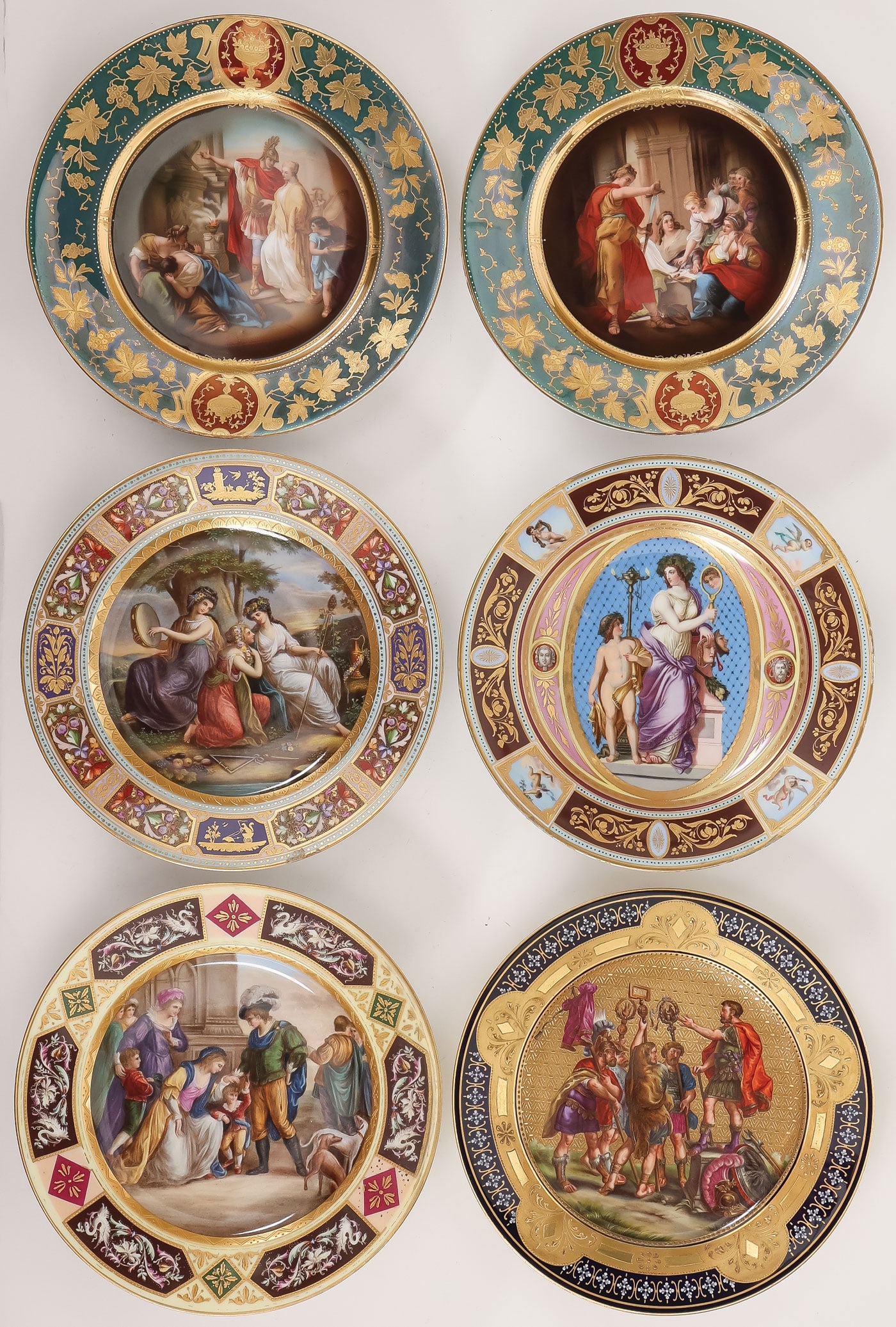 6 ORNATE CABINET PLATES: 6 ORNATE CABINET PLATES Comprising a good group of six porcelain cabinet plates from top to bottom, left to right: they include a pair of matching plates with raised gilt grapevine decorated borders o