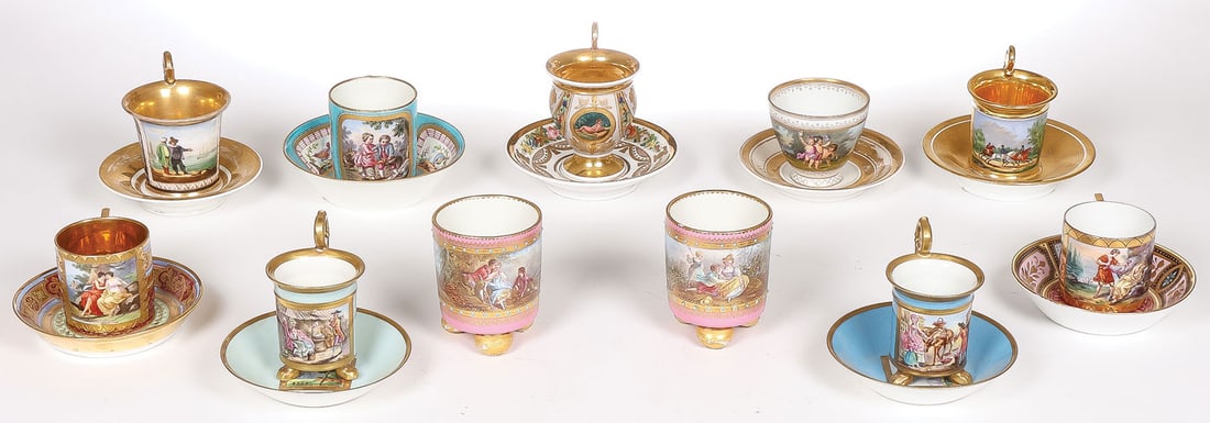 BIEDERMEIER PORCELAIN CUPS & SAUCERS GROUP: BIEDERMEIER PORCELAIN CUPS & SAUCERS GROUP. Comprising a good group of mostly French hand-decorated cups and saucers, some with Sèvres marks, one with Royal Vienne (blue beehive) mark, together w