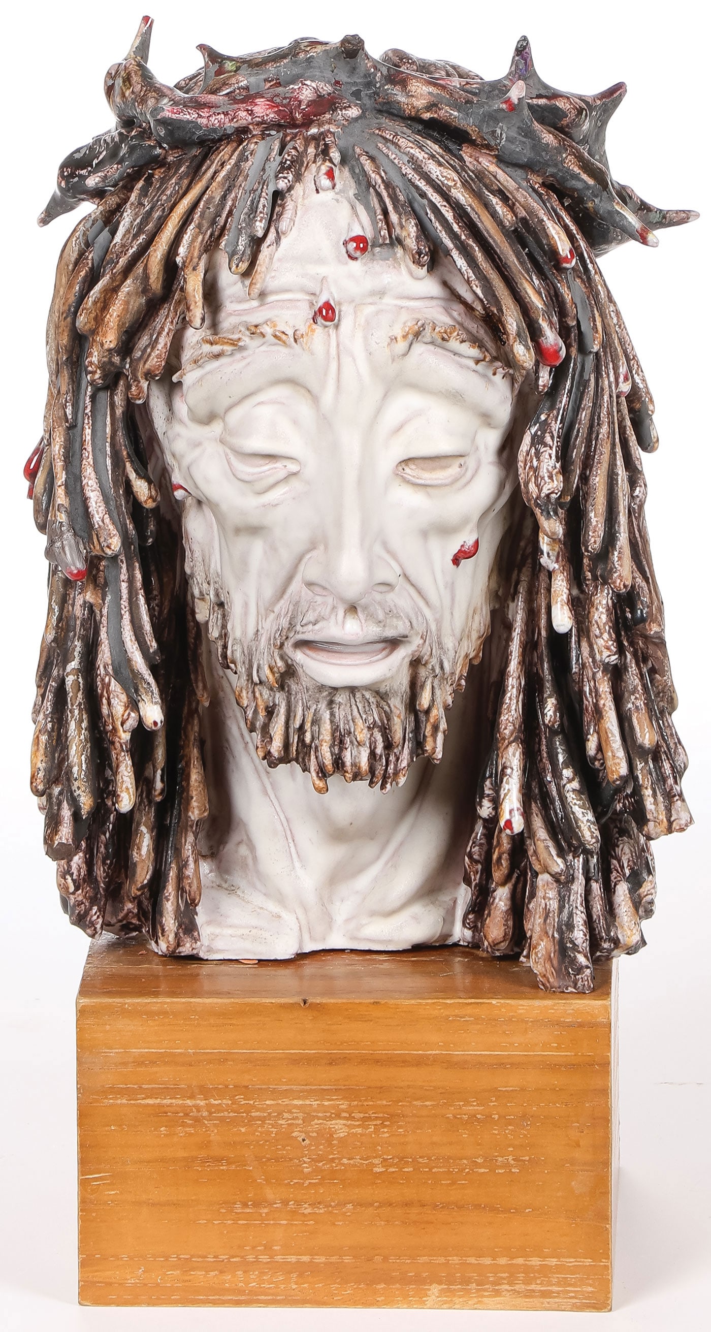 PATARINNO HEAD OF CHRIST: PATARINNO HEAD OF CHRIST. Comprising a finely sculpted and glazed bust of Christ with crown of thorns (Ecce Homo), resting on original wood base, signed Prof. E. Patarrino, Italy. Overall height on