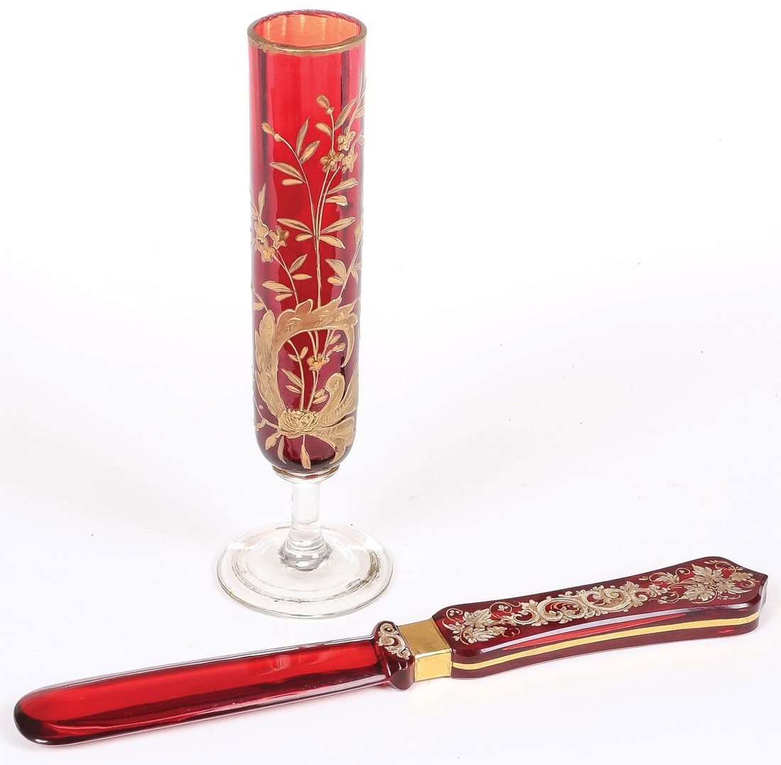 GILT DECORATED RUBY RED GLASS: GILT DECORATED RUBY RED GLASS. Comprising a pair of gilt decorated ruby red glass objects, probably Bohemian, circa 1890. Including a heavy handled mixer(?) of knife form with rounded blade, the handl