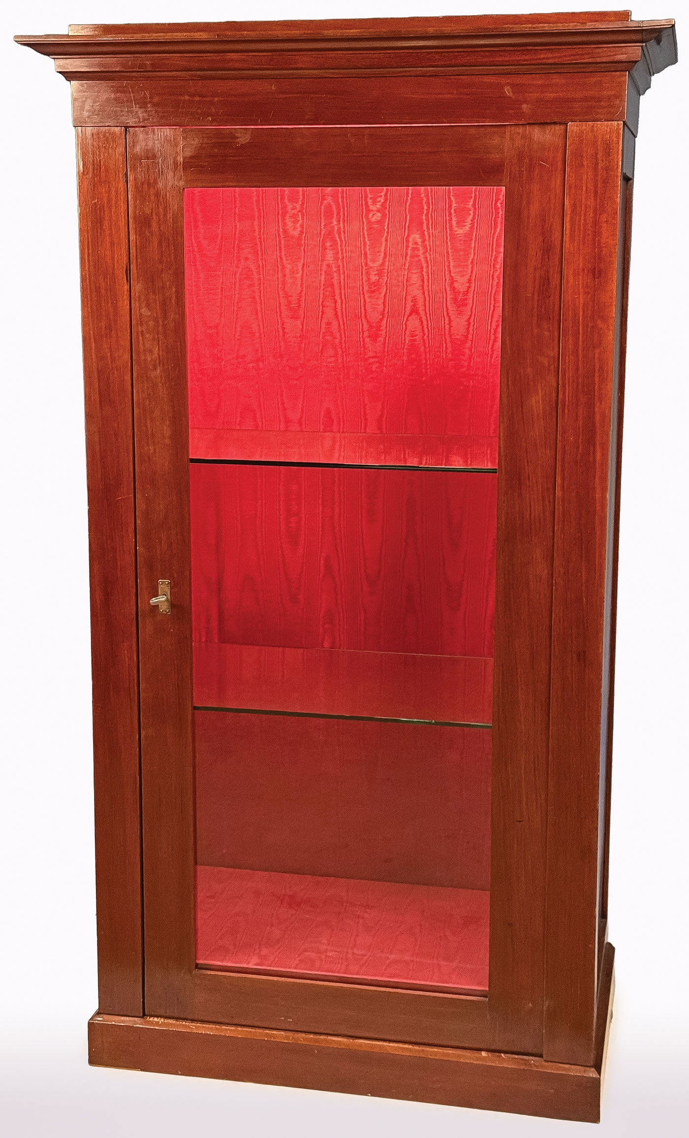 ATTRACTIVE VINTAGE DISPLAY CASE: ATTRACTIVE VINTAGE DISPLAY CASE. With single glass door beneath an overhanging cornice and cloth-lined interior and recently illuminated. Greatest height 75.5 inches (191.8cm), width 42.75 inches