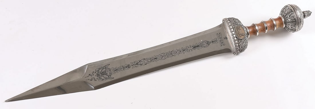 A ROMAN LEGIONNAIRES SWORD: A ROMAN LEGIONNAIRES SWORD. A finely crafted facsimile of a double-edged Roman Legionnaire's sword. Length 27 inches (68.6cm). SHIPPING NOTICE: If you are not using the Live Auctioneers Live Ship