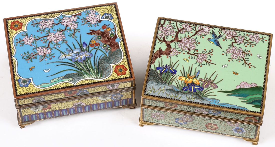 PAIR OF JAPANESE CLOISONNE BOXES, ANDO: PAIR OF JAPANESE CLOISONNE BOXES, ANDO. Comprising a pair of finely enameled boxes, each resting on four bracket feet at each corner, the sides banded in colorful flower heads and repeating patterns, 