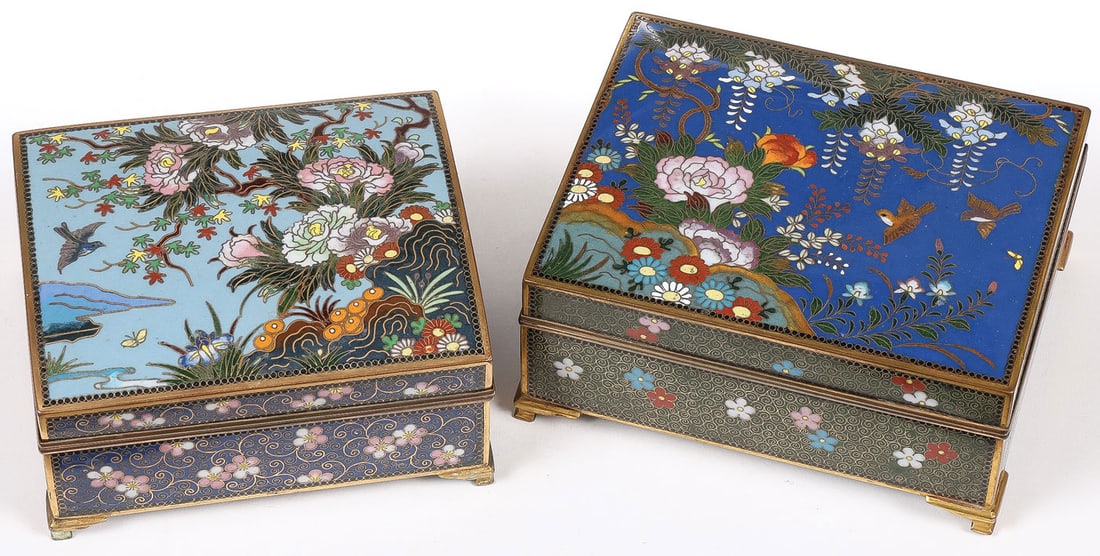 2 VERY FINE JAPANESE CLOISONNE ENAMEL BOXES, MEIJ: 2 VERY FINE JAPANESE CLOISONNE ENAMEL BOXES, MEIJI. Each resting on gilt bracket feet, the sides banded in colorful flower heads, the hinged lids with blossoming landscapes with birds, the interiors g