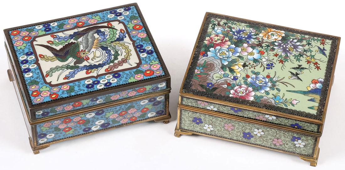 PR JAPANESE CLOISONNE BOXES, INABA, MEIJI: PR JAPANESE CLOISONNE BOXES, INABA, MEIJI. Comprising a pair, both on gilt bracket feet, the hinged lid of one with birds amidst blossoming flower on moss green ground, the other with exotic bird, bot