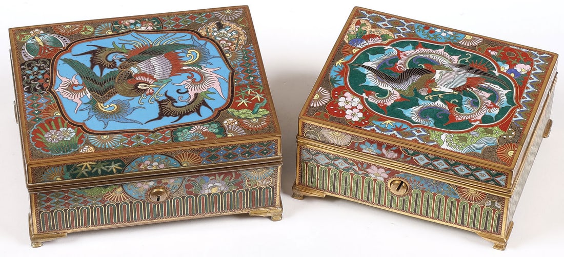 PR JAPANESE CLOISONNE BOXES, MEIJI: PR JAPANESE CLOISONNE BOXES, MEIJI. Comprising a pair of finely enameled boxes, Meiji. Both resting on gilt bracket feet, the hinged lid of both with exotic bird within a shaped cartouche, overall ena
