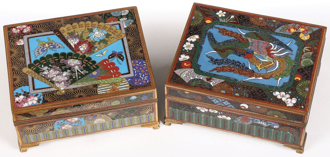 PR OF EXQUISITE JAPANESE CLOISONNE BOXES, MEIJI: PR OF EXQUISITE JAPANESE CLOISONNE BOXES, MEIJI. Comprising a pair of Japanese finely enameled boxes, Meiji. Both on gilt bracket feet, the hinged lid of one with a phoenix, the other with fans, both 