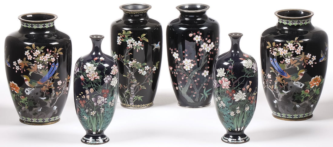 3 MATCHING JAPANESE CLOISONNE ENAMEL VASES, MEIJI: 3 MATCHING JAPANESE CLOISONNE ENAMEL VASES, MEIJI. Each finely decorated with floral and blossoming tree decoration on a dark blue ground as shown. One with Sato mark. 7.25 inches (18.5cm). SHIPPING N