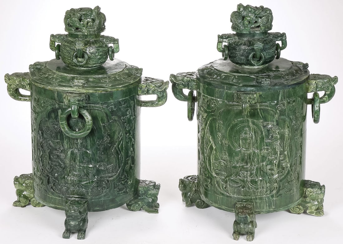PR MASSIVE CHINESE CARVED JADE URNS: PR MASSIVE CHINESE CARVED JADE URNS. Comprising a large and impressive pair of carved spinach jade lidded vessels or urns. Each of cylindrical form, resting on four equally spaced foo lion legs, both 