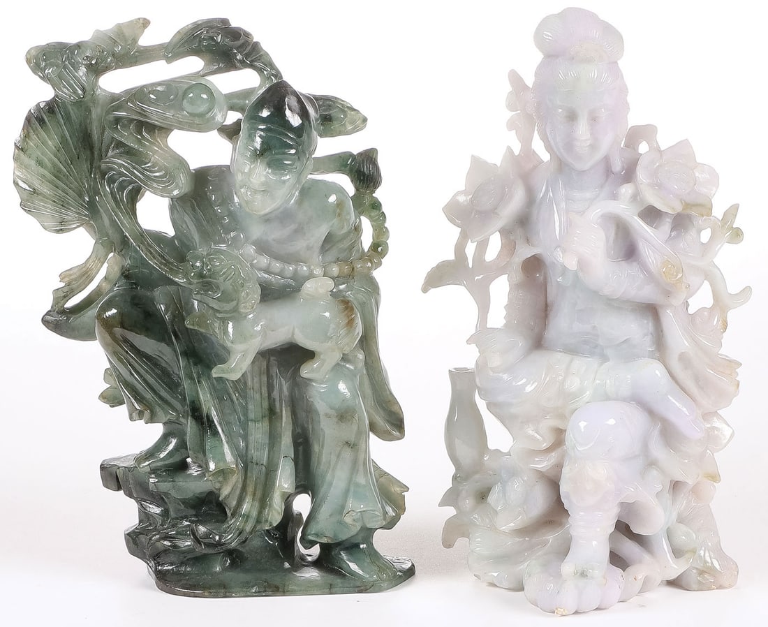 2 CHINESE CARVED JADE FIGURES: 2 CHINESE CARVED JADE FIGURES. Comprising two finely carved jade figures, one depicting a seated Guanyin, the other a male figure holding a foo lion beneath bats. Both finely carved in full round, wit