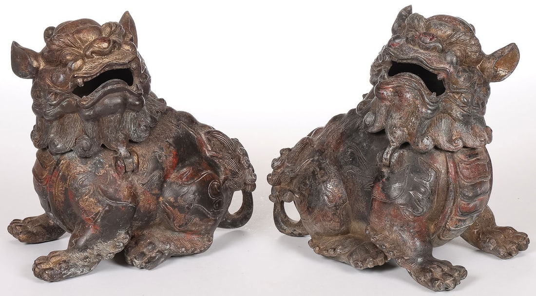 PR CHINESE BRONZE LION CENSERS: PR CHINESE BRONZE LION CENSERS. Comprising a pair of bronze gilt, polychrome, and patinated lion-form censers, each with hinged head and each measuring height 6.25 inches (15.9cm), width 6.5 inches (1