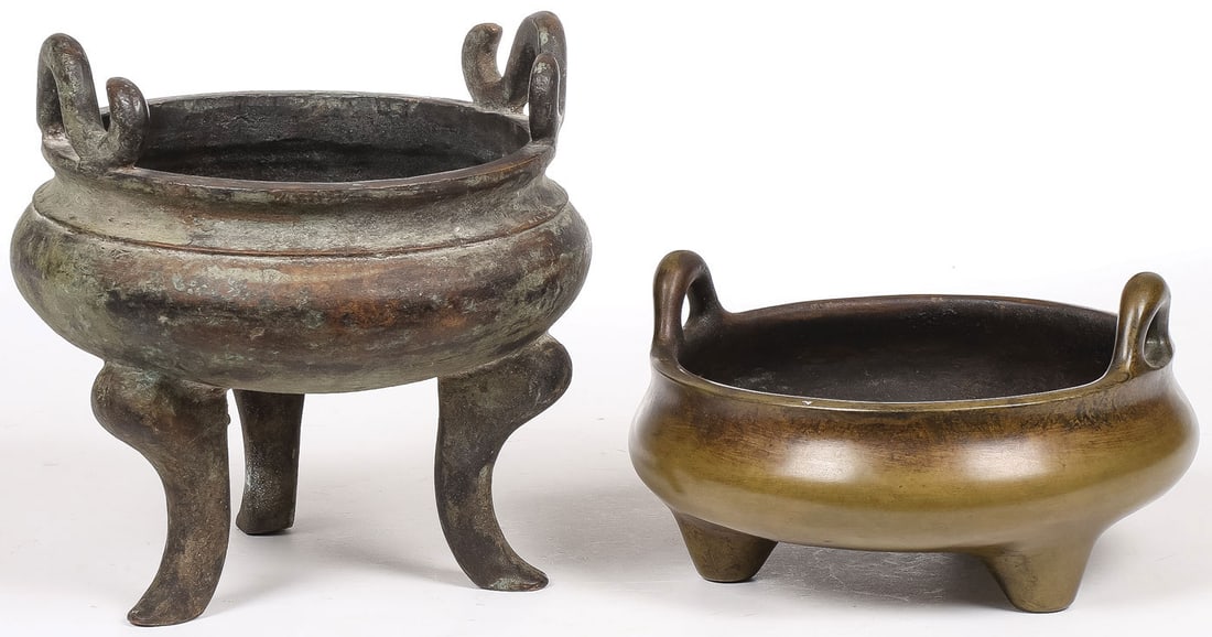 PR CHINESE BRONZE CENSERS: PR CHINESE BRONZE CENSERS. Comprising two good Chinese patinated bronze censers, one resting on three curved legs with scroll handles and the other on three short legs with hoop handles, the underside