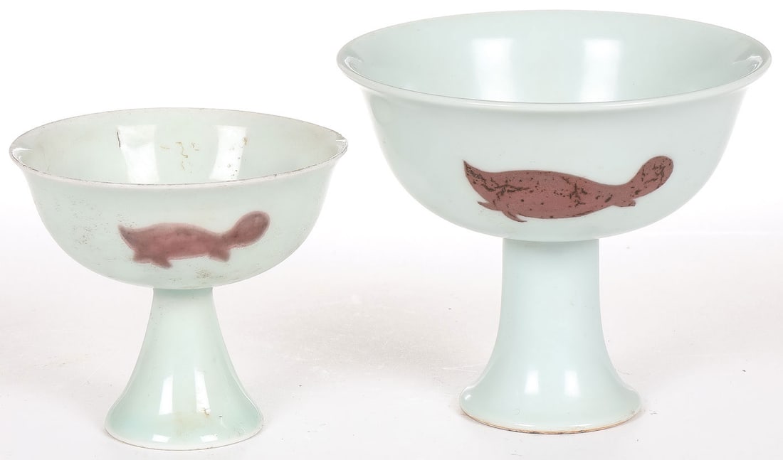 PR CHINESE FOOTED BOWLS: PR CHINESE FOOTED BOWLS. Comprising a pair of Chinese underglaze red "Three Fish" stemmed cups. The interior of both with double circle mark, the largest reading, "Made during the Xuande period of the