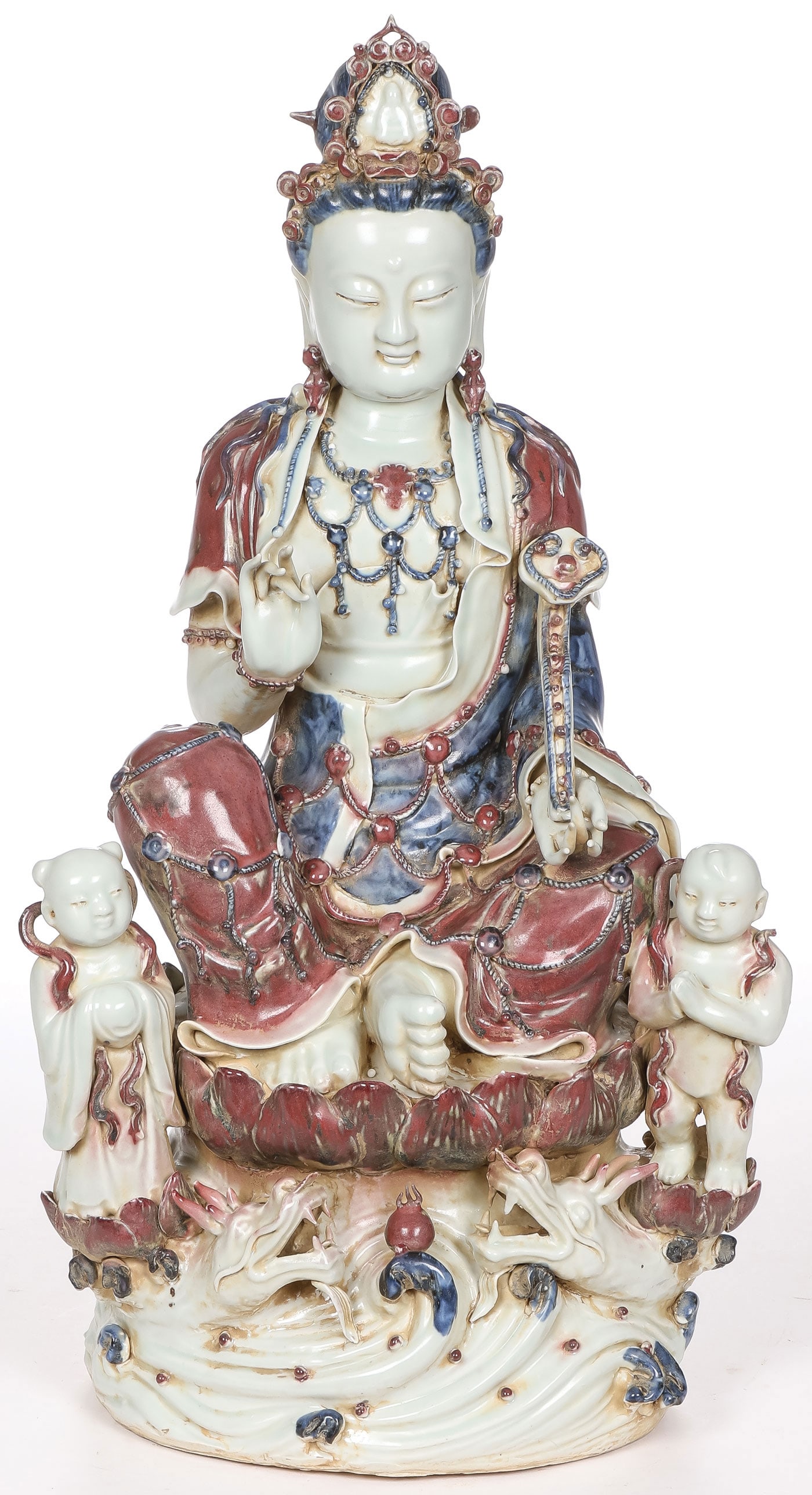IMPRESSIVE CHINESE GLAZED GUANYIN: IMPRESSIVE CHINESE GLAZED GUANYIN. Comprising a large and impressive finely sculpted figure of Guanyin with two attendants resting on a lotus blossom above two dragons chasing the pearl of wisdom, wit