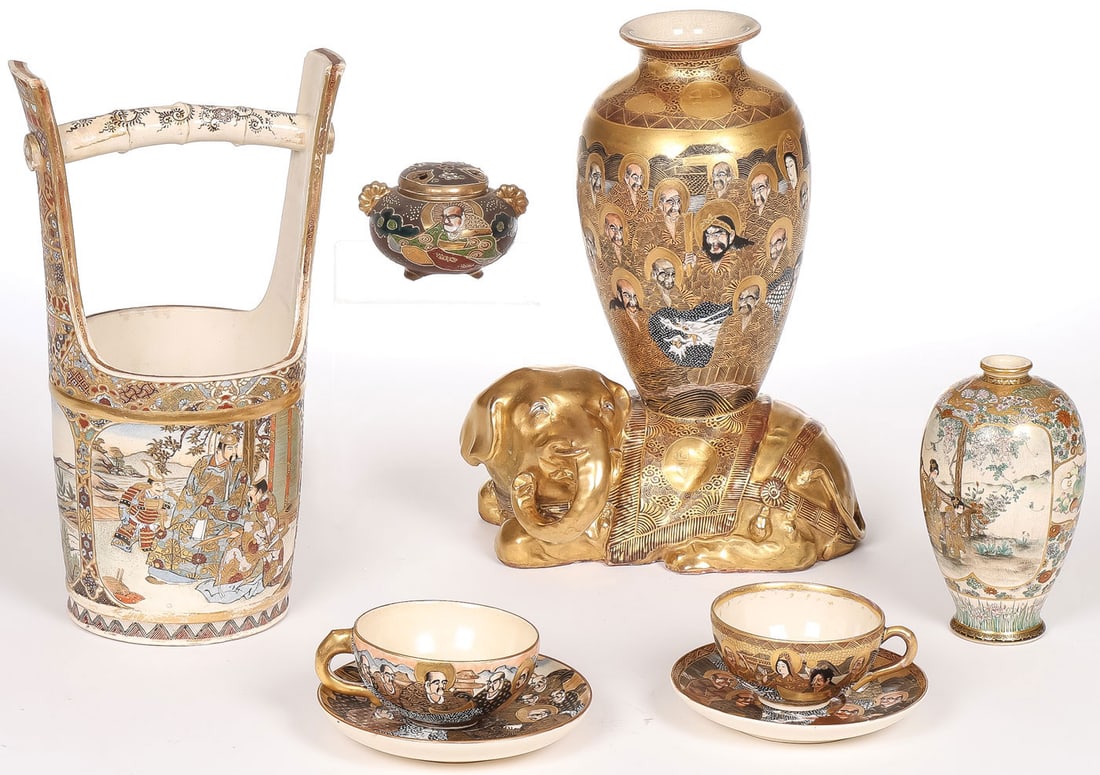 8 PCS. JAPANESE SATSUMA WARE: 8 PCS. JAPANESE SATSUMA WARE. Comprising a large gilt decorated elephant vase, signed on underside; a finely painted bucket form vase; a finely painted vase with maidens, flowers, and fruit, signed on