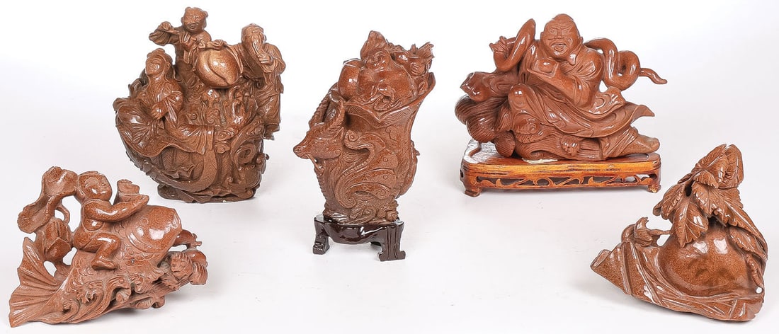 5 CHINESE CARVED GOLD STONE PIECES: 5 CHINESE CARVED GOLD STONE PIECES. Comprising a good group of large and impressive Chinese carved goldstone groups, including a Buddha with snake on conforming wood stand, a boy riding a fish, a gour