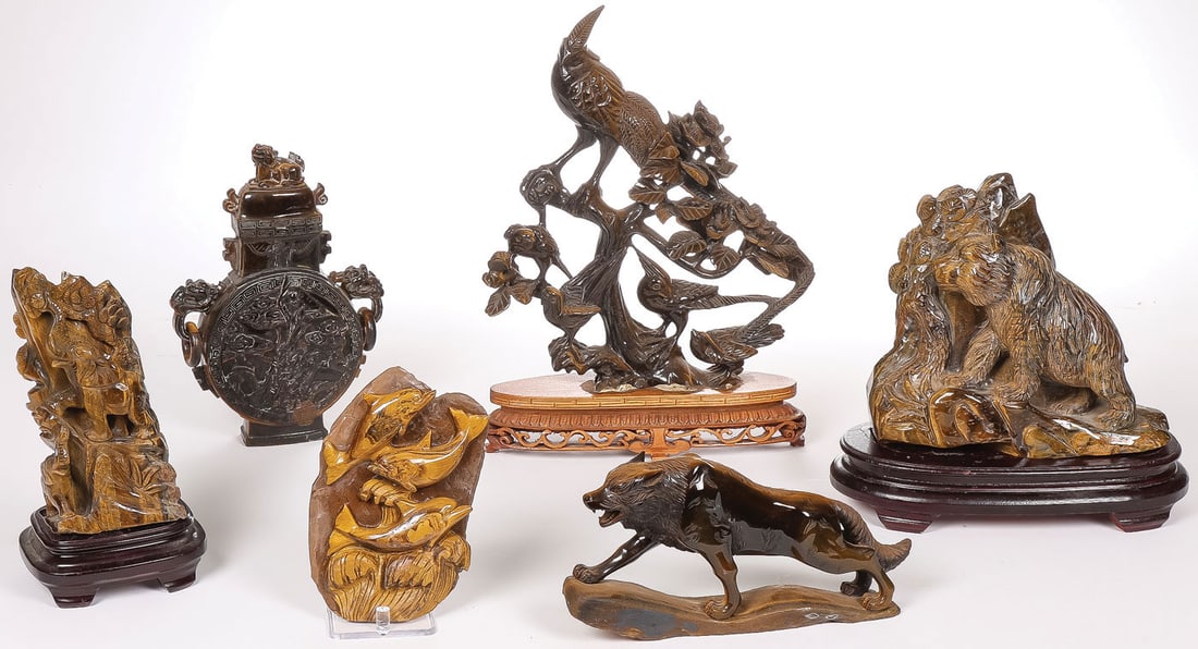CHINESE CARVED TIGERS EYE: CHINESE CARVED TIGERS EYE. Comprising six finely carved tiger's eye sculptures, including a large tree with birds on a conforming wood stand, a large bear on a conforming wood stand, elephants