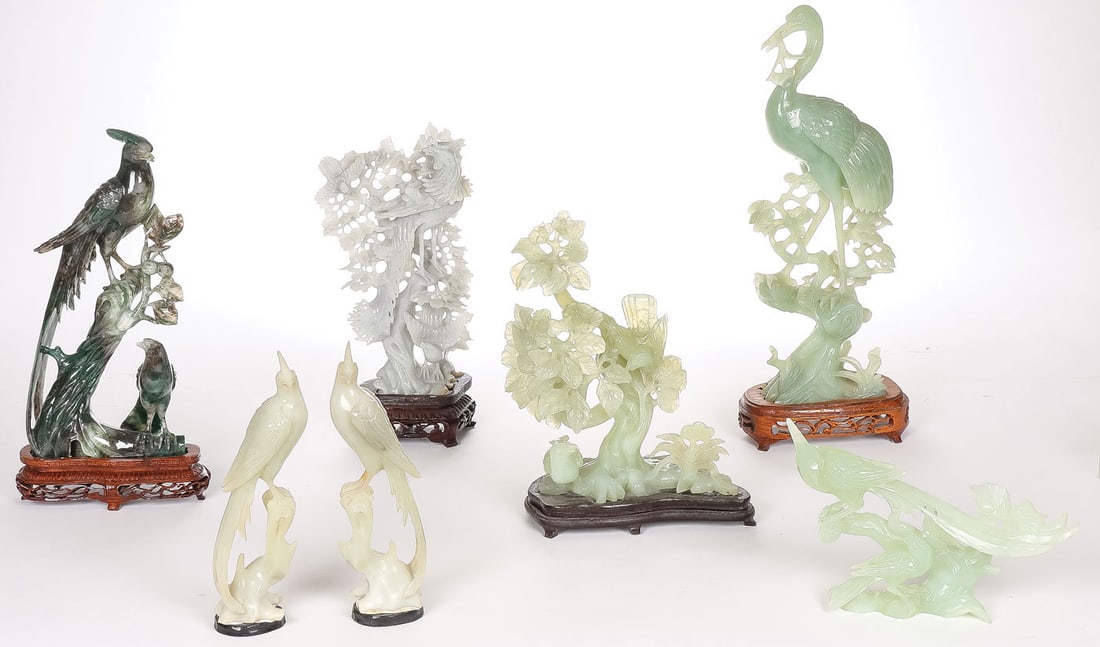 7 CHINESE CARVED JADE BIRD GROUPINGS: 7 CHINESE CARVED JADE BIRD GROUPINGS. Comprising a group of five finely carved jade birds and two carved hardstone birds, all but one on a conforming wood stand. Each finely carved in full round with