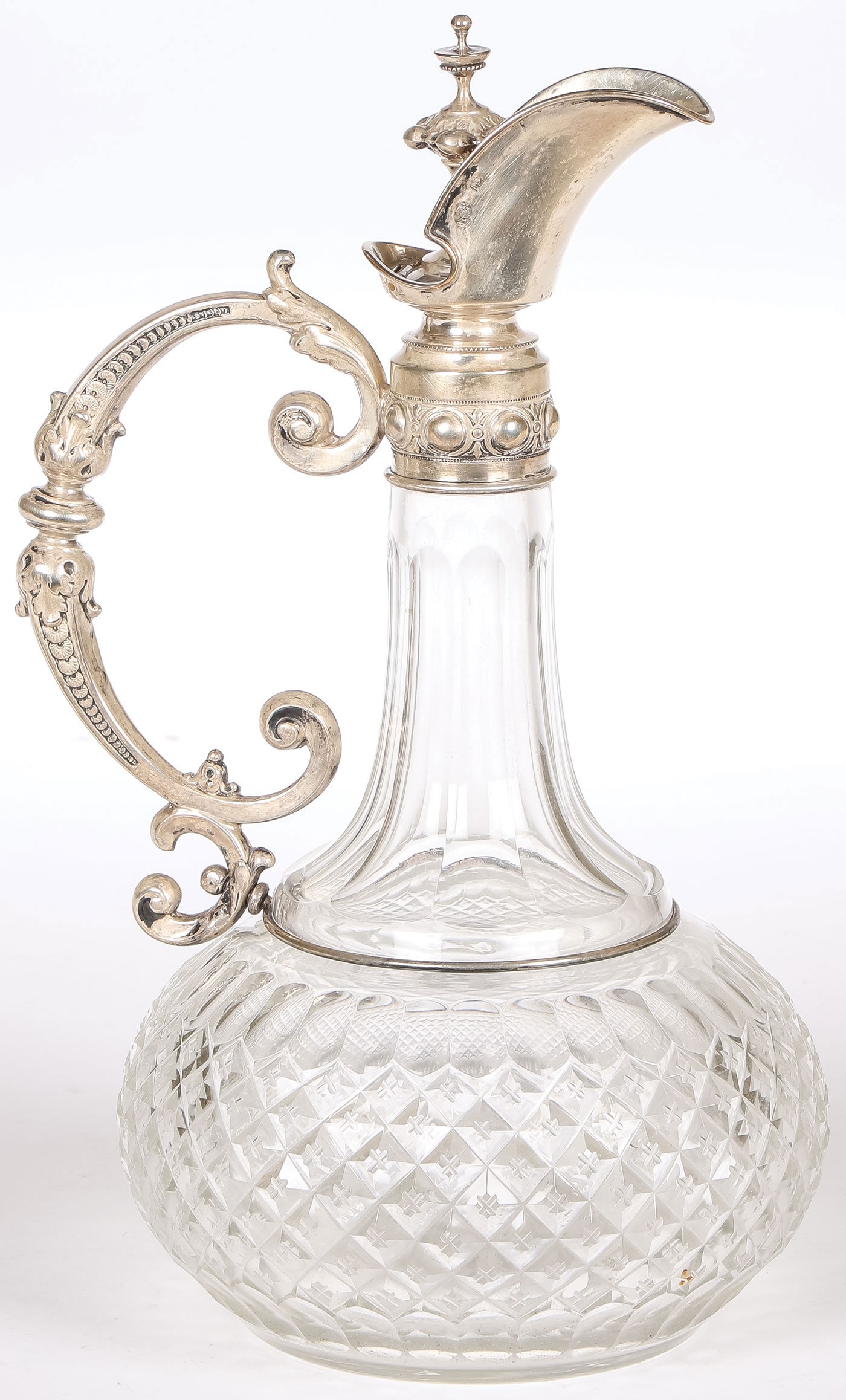 FABERGE SILVER MOUNTED CLARET JUG, RAPPOPORT: FABERGE SILVER MOUNTED CLARET JUG, JULIUS RAPPOPORT. Comprising a fine Faberge silver-mounted cut-glass claret jug, of bulbous bottle form with cut diamond pattern and etched crosses, the tapering nec